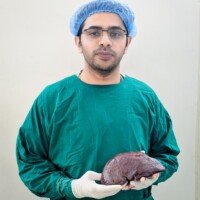 Dr. Prosenjit Datta - Child Surgeon, holding a resected Spleen after a successful splenectomy operation